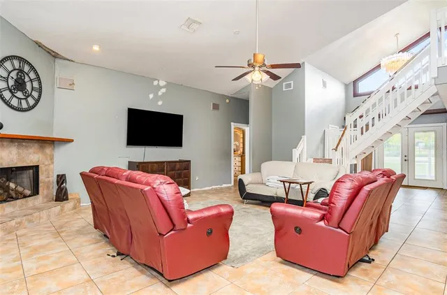 a kitchen with stainless steel appliances granite countertop a sink and a couch