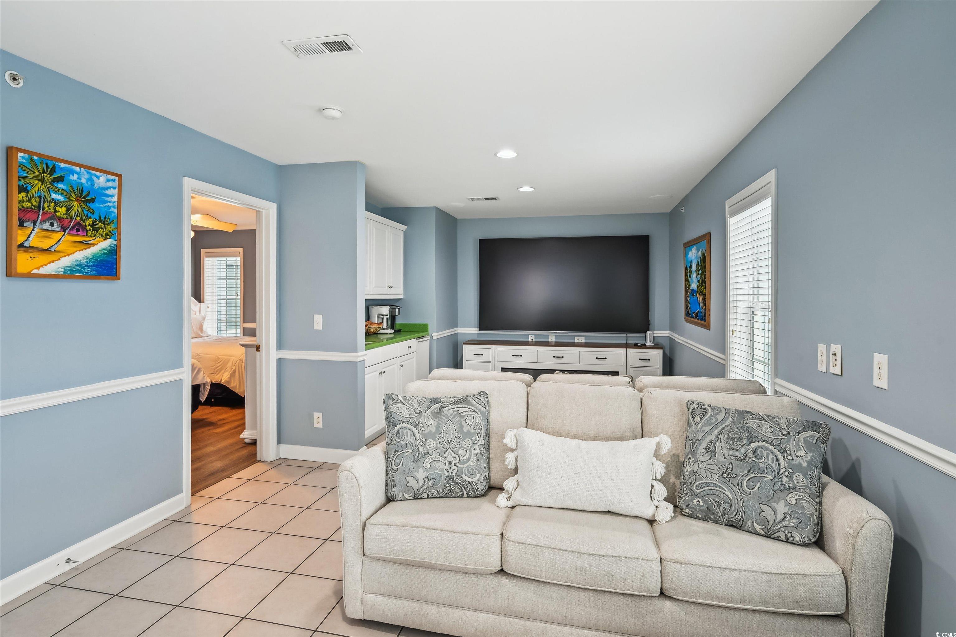 931 South Ocean Boulevard North Myrtle Beach, SC 29582 - Photo 22 of 40 Living area featuring light tile patterned floors, plenty of natural light, and recessed lighting