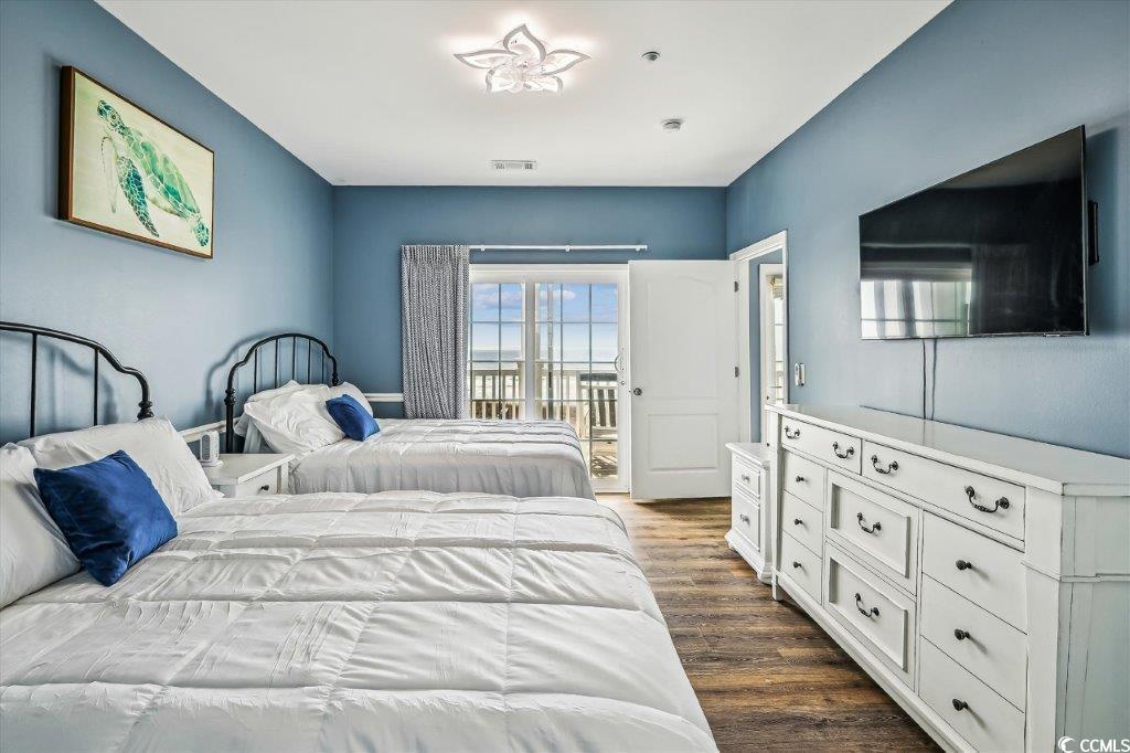 931 South Ocean Boulevard North Myrtle Beach, SC 29582 - Photo 24 of 40 Bedroom with access to outside and dark wood-style floors