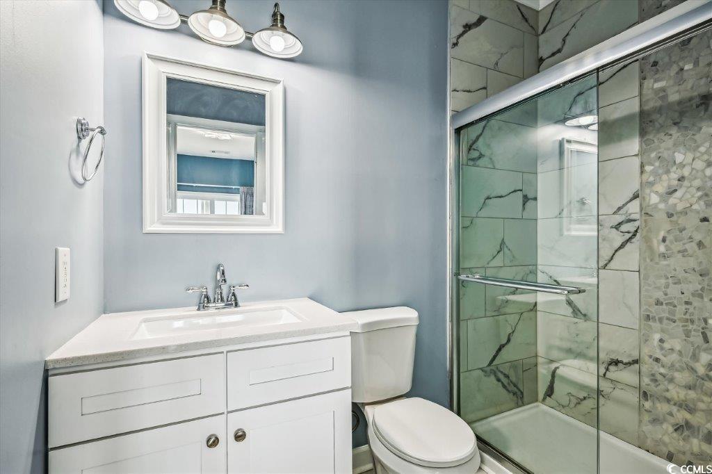 931 South Ocean Boulevard North Myrtle Beach, SC 29582 - Photo 25 of 40 Full bath featuring vanity and a stall shower