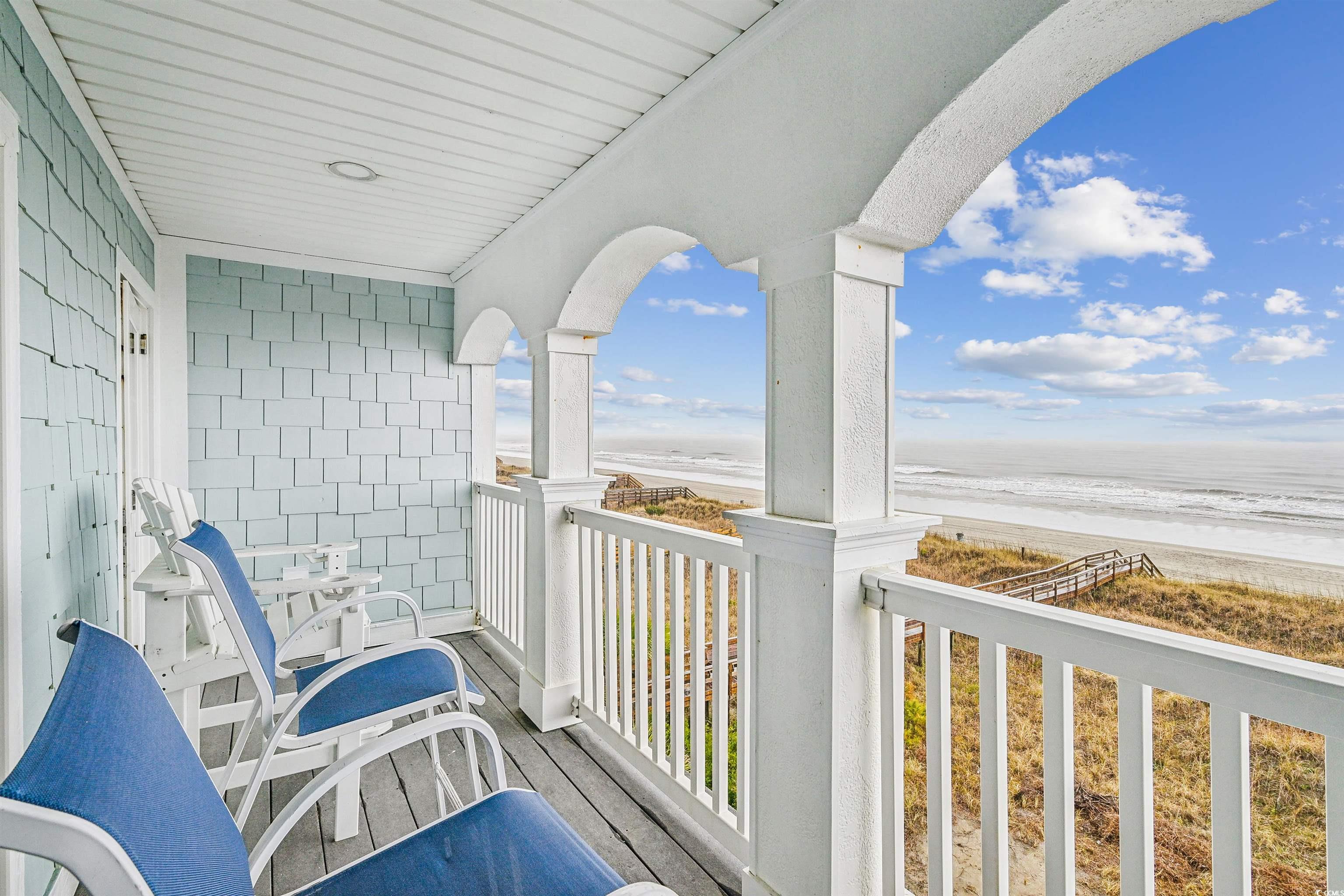 931 South Ocean Boulevard North Myrtle Beach, SC 29582 - Photo 30 of 40 Balcony featuring view of water and beach
