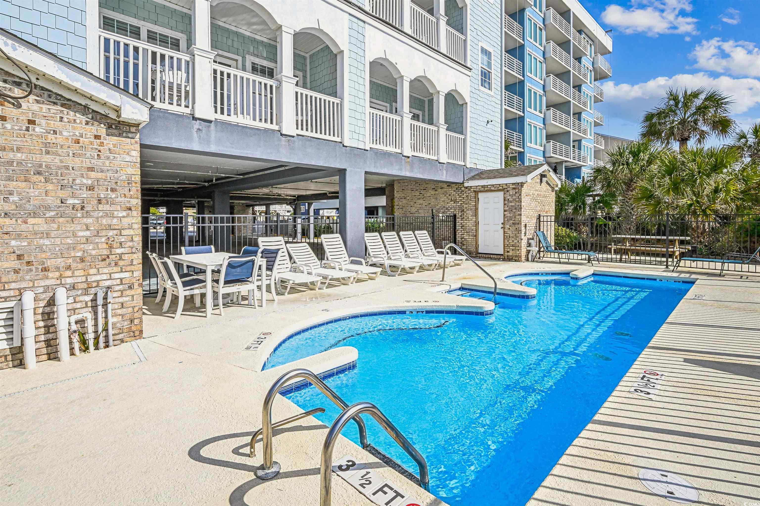 931 South Ocean Boulevard North Myrtle Beach, SC 29582 - Photo 38 of 40 Community pool with a patio area