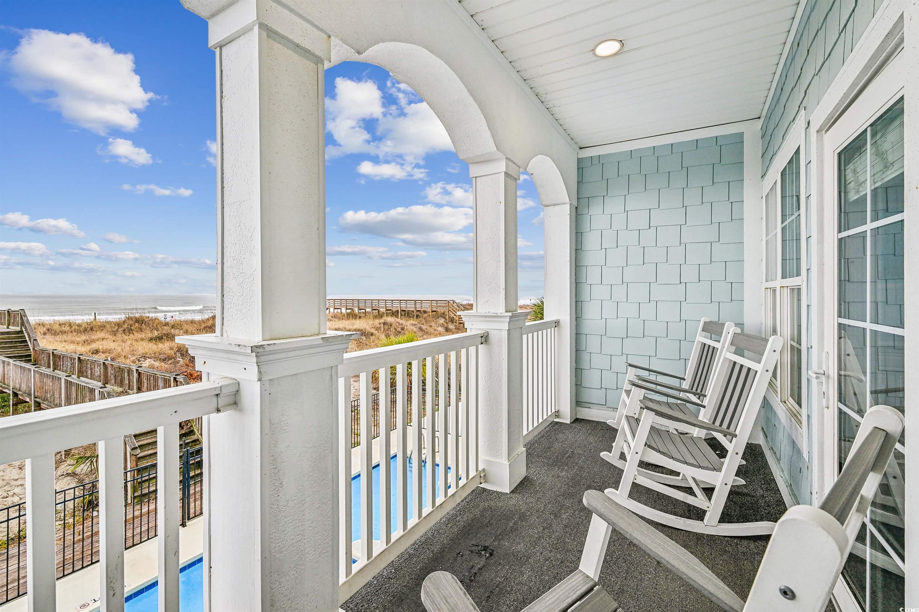 931 South Ocean Boulevard North Myrtle Beach, SC 29582 - Photo 5 of 40 Balcony with view of water and beach