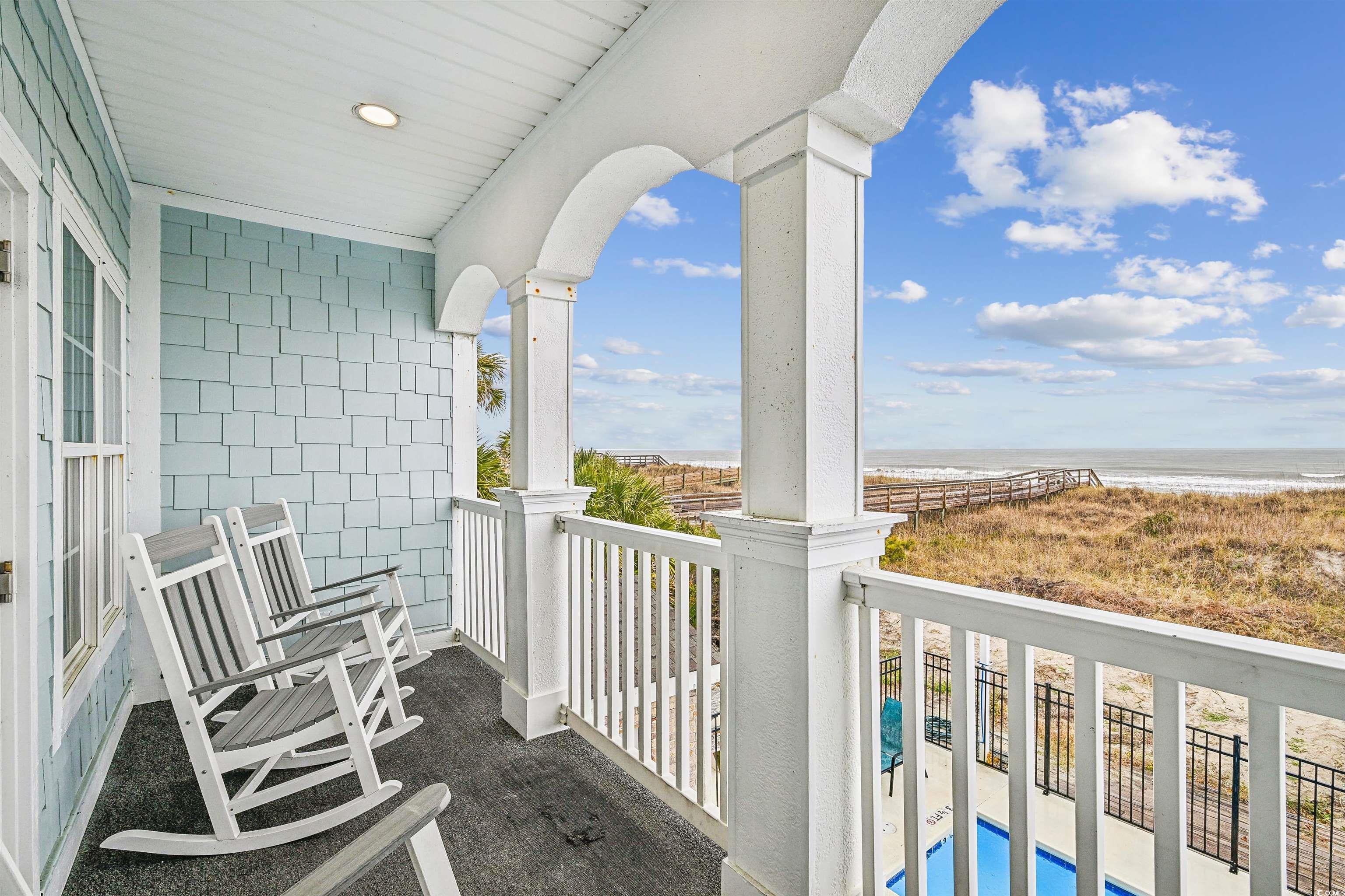 931 South Ocean Boulevard North Myrtle Beach, SC 29582 - Photo 6 of 40 Balcony featuring view of water and beach and view of pool