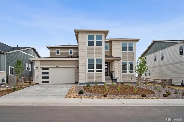 a front view of a house with a garage