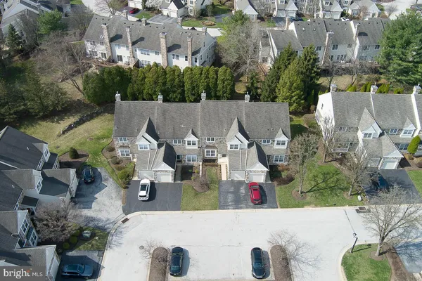 an aerial view of a house with swimming pool