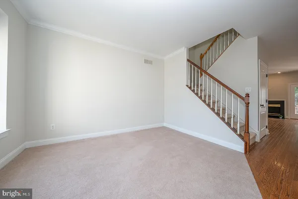 a view of a hallway with staircase
