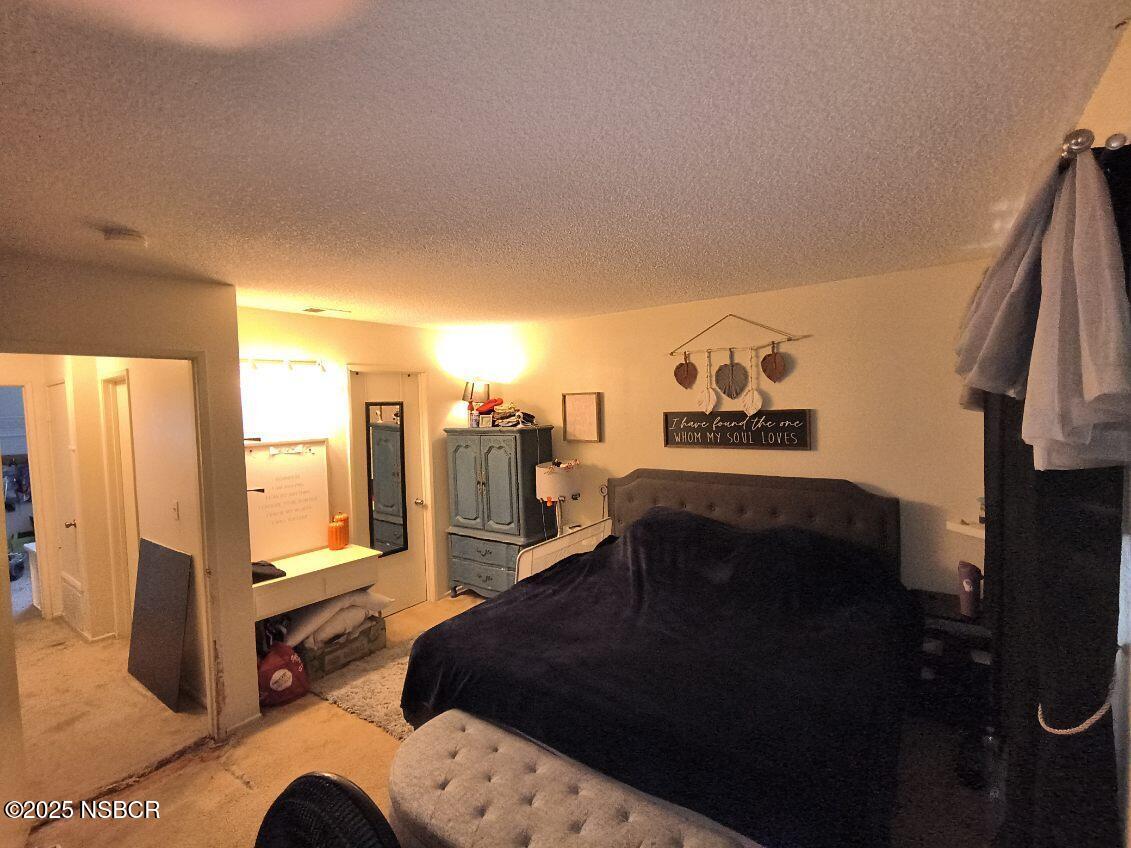 413 East Park Avenue, Unit C3 Santa Maria, CA 93454 - Photo 11 of 26 a living room with furniture and a flat screen tv