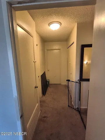 a view of a hallway with an empty space