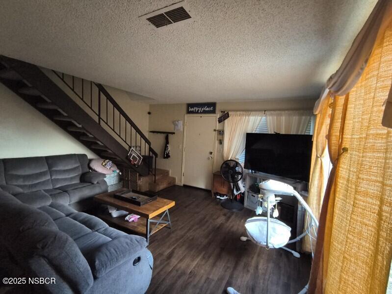 413 East Park Avenue, Unit C3 Santa Maria, CA 93454 - Photo 20 of 26 a living room with furniture and a flat screen tv