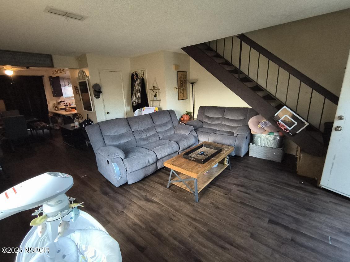 413 East Park Avenue, Unit C3 Santa Maria, CA 93454 - Photo 21 of 26 a living room with furniture and a wooden floor