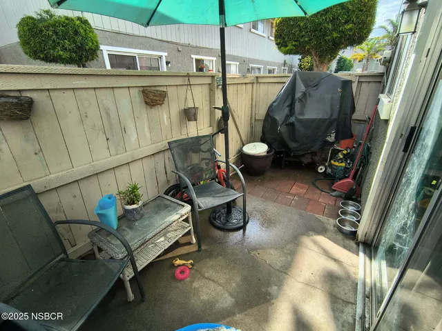 a backyard of a house with seating space