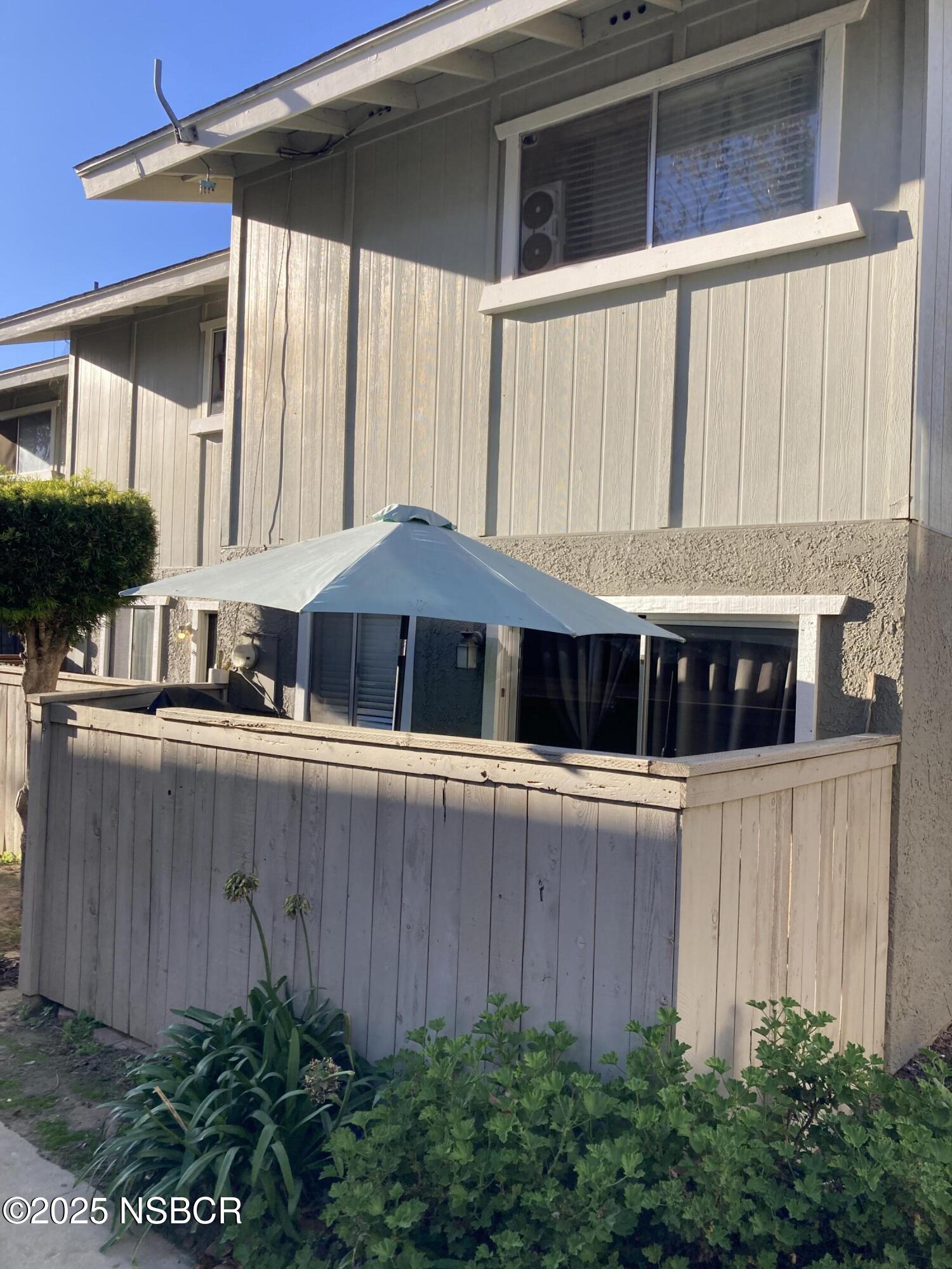 413 East Park Avenue, Unit C3 Santa Maria, CA 93454 - Photo 25 of 26 a front view of a house with a garden