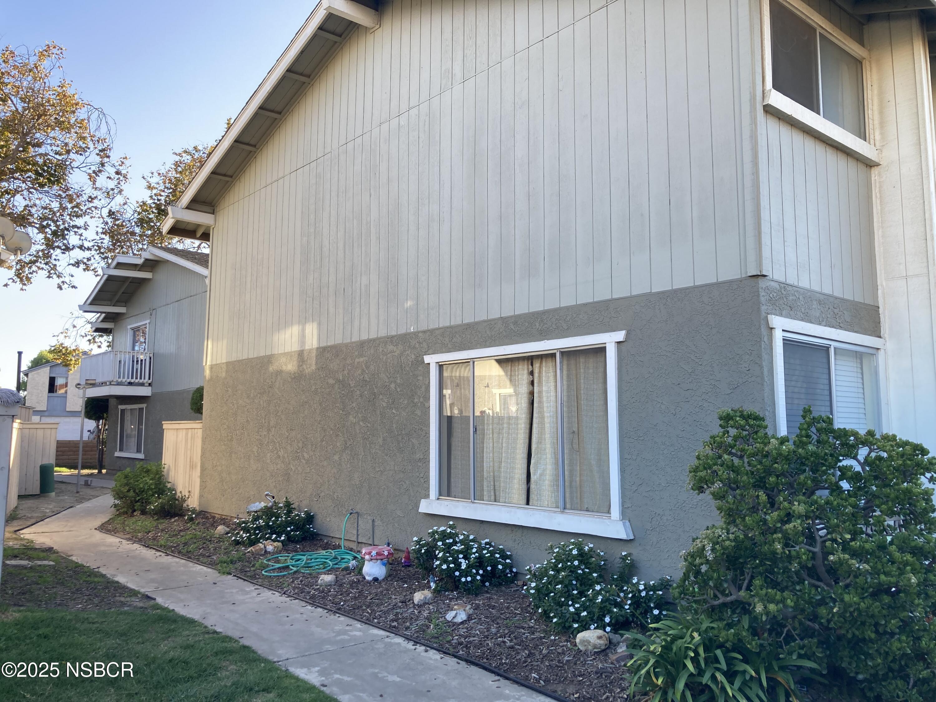 413 East Park Avenue, Unit C3 Santa Maria, CA 93454 - Photo 26 of 26 a front view of a house with garden
