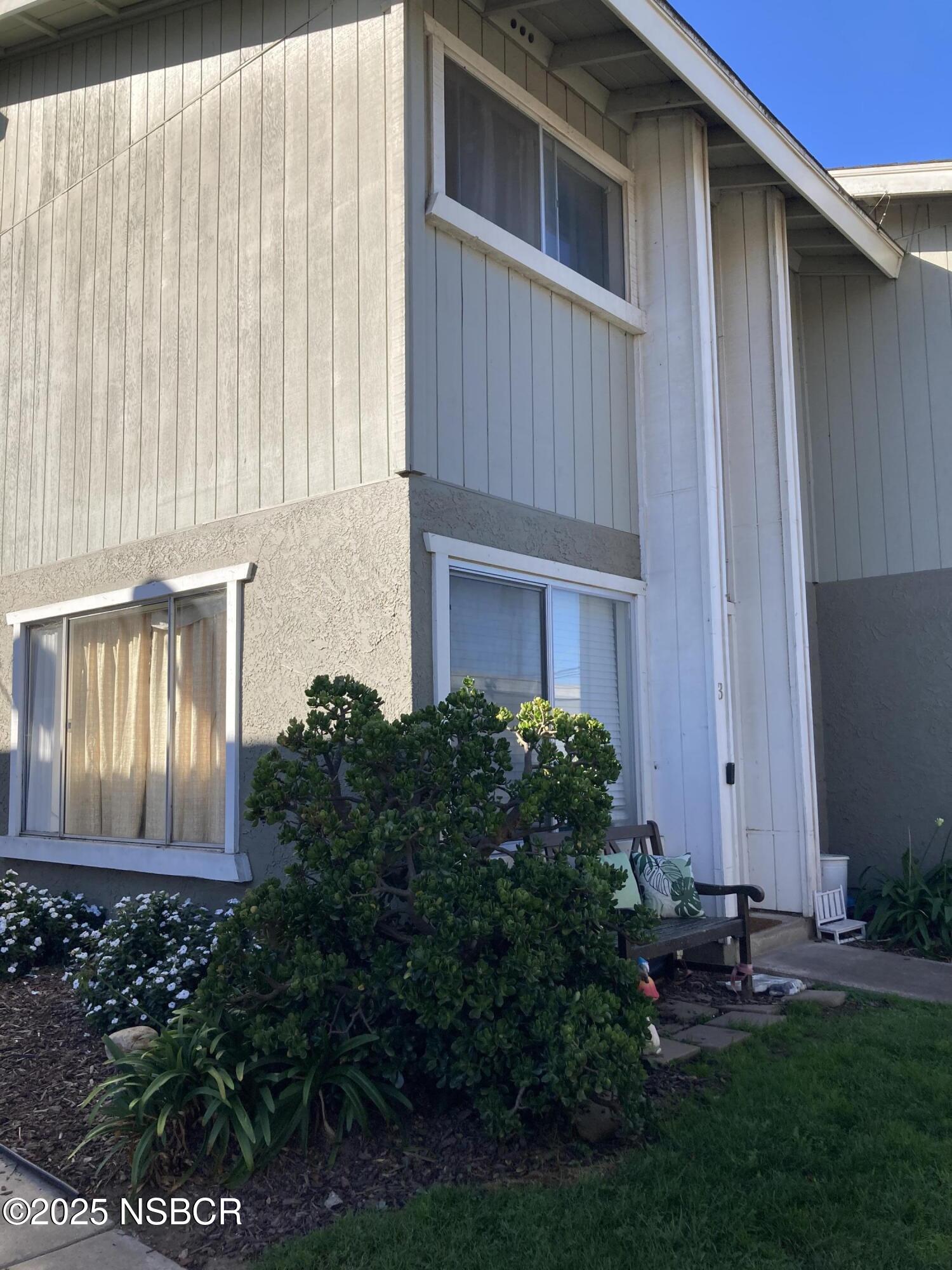 413 East Park Avenue, Unit C3 Santa Maria, CA 93454 - Photo 5 of 26 a front view of a house with garden