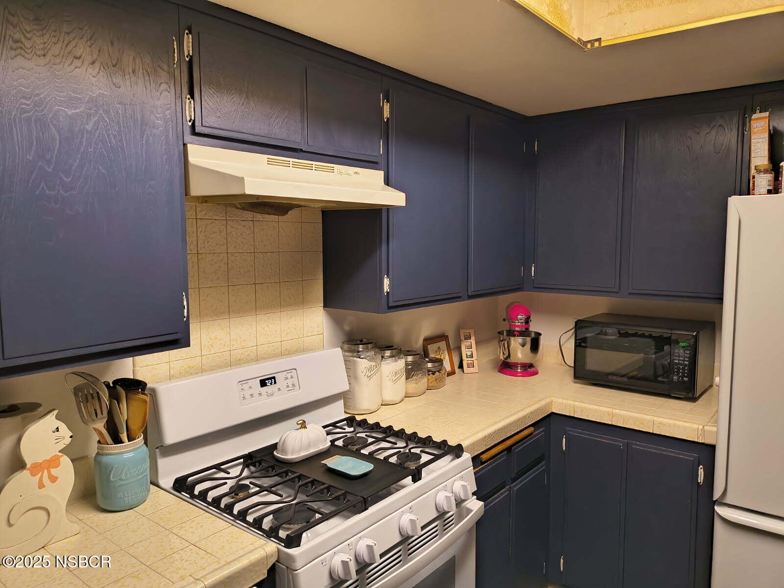 413 East Park Avenue, Unit C3 Santa Maria, CA 93454 - Photo 8 of 26 a stove top oven sitting inside of a kitchen