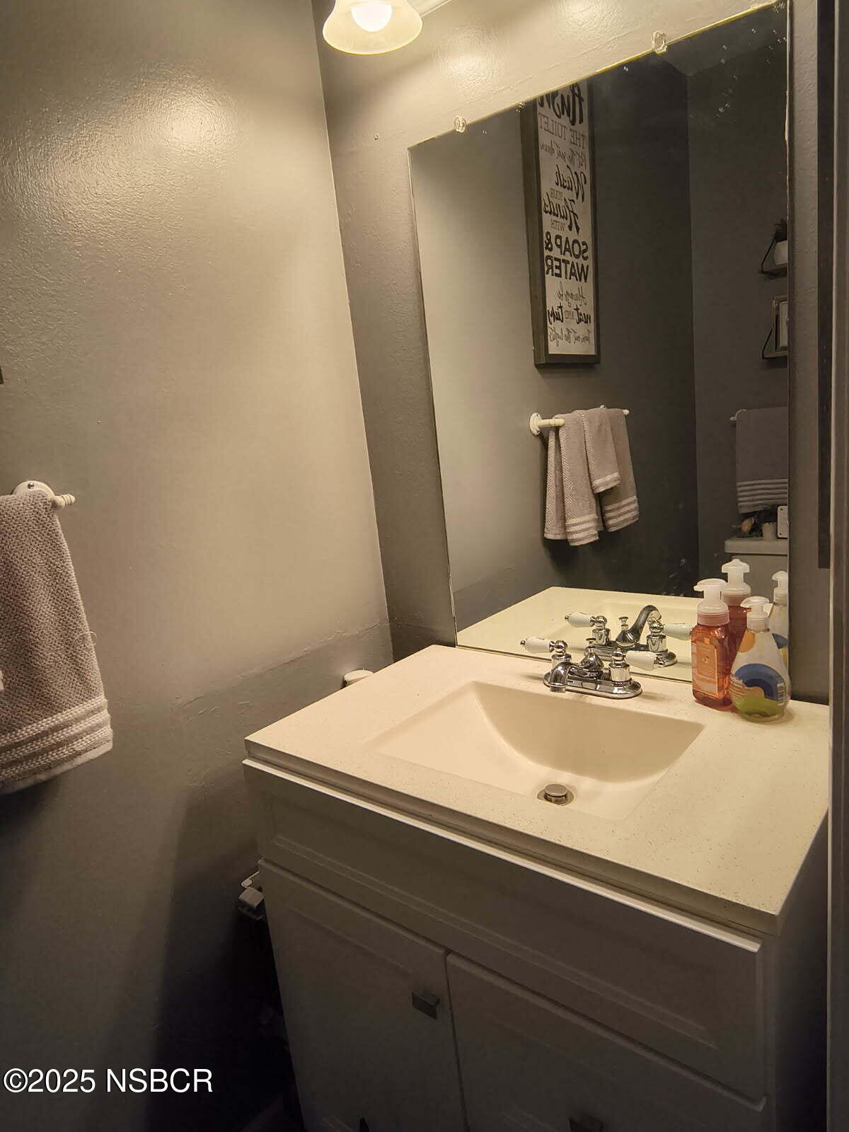 413 East Park Avenue, Unit C3 Santa Maria, CA 93454 - Photo 10 of 26 a bathroom with a sink and a mirror