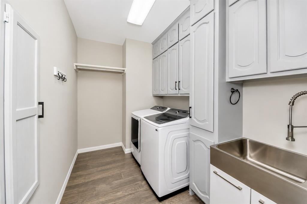 3817 Ganzer Road West Denton, TX 76207 - Photo 11 of 40 The laundry room is designed for everyday efficiency, with a laundry chute tucked between the washer and the sink for quick drop-offs from upstairs. The layout has room for a full wine fridge if someone wants it, and the deep utility sink is ideal for bathing family pets or handling bigger cleanup tasks. It’s a bright, organized space that keeps the home running smoothly.