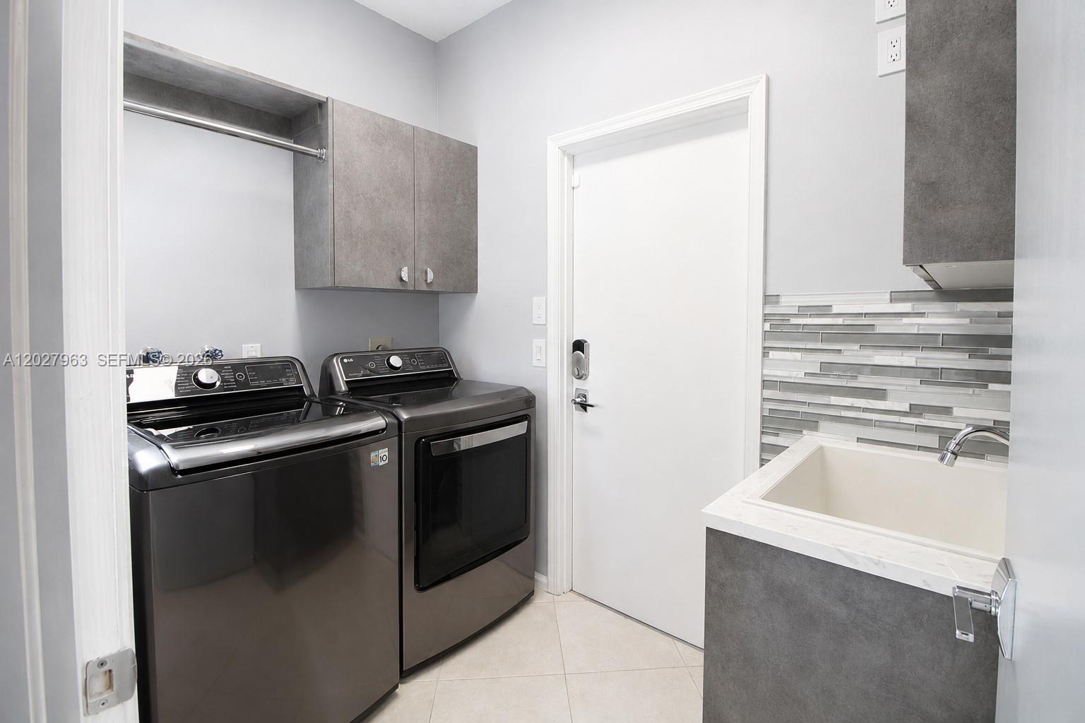 6646 Northwest 25th Terrace Boca Raton, FL 33496 - Photo 32 of 48 a white stove top oven sitting inside of a kitchen