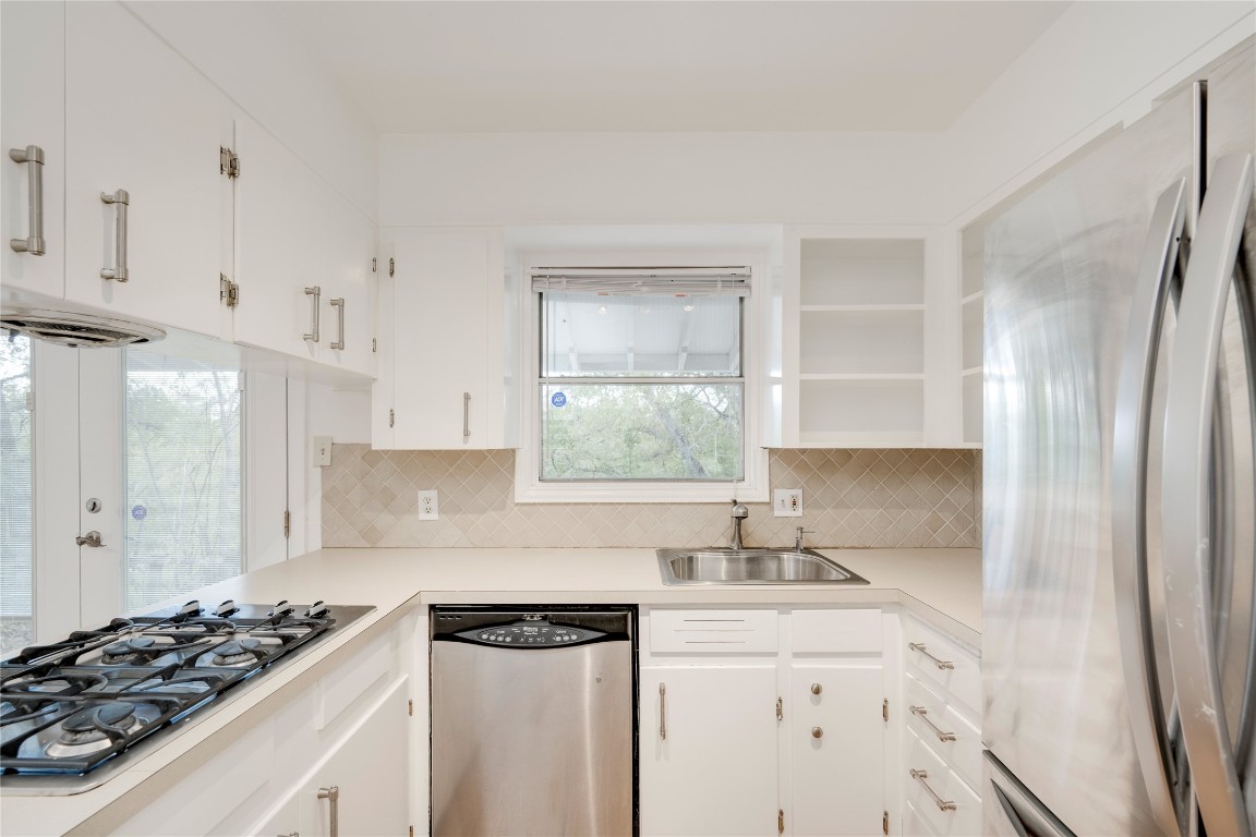 4710 Roundup Trail Austin, TX 78745 - Photo 11 of 26 a kitchen with a sink stove and refrigerator