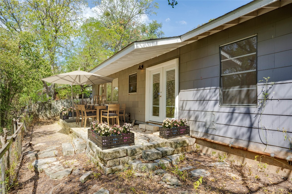 4710 Roundup Trail Austin, TX 78745 - Photo 17 of 26 a view of a chairs and table in backyard of the house