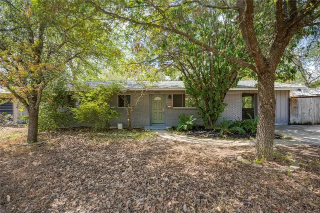 front view of house with a trees