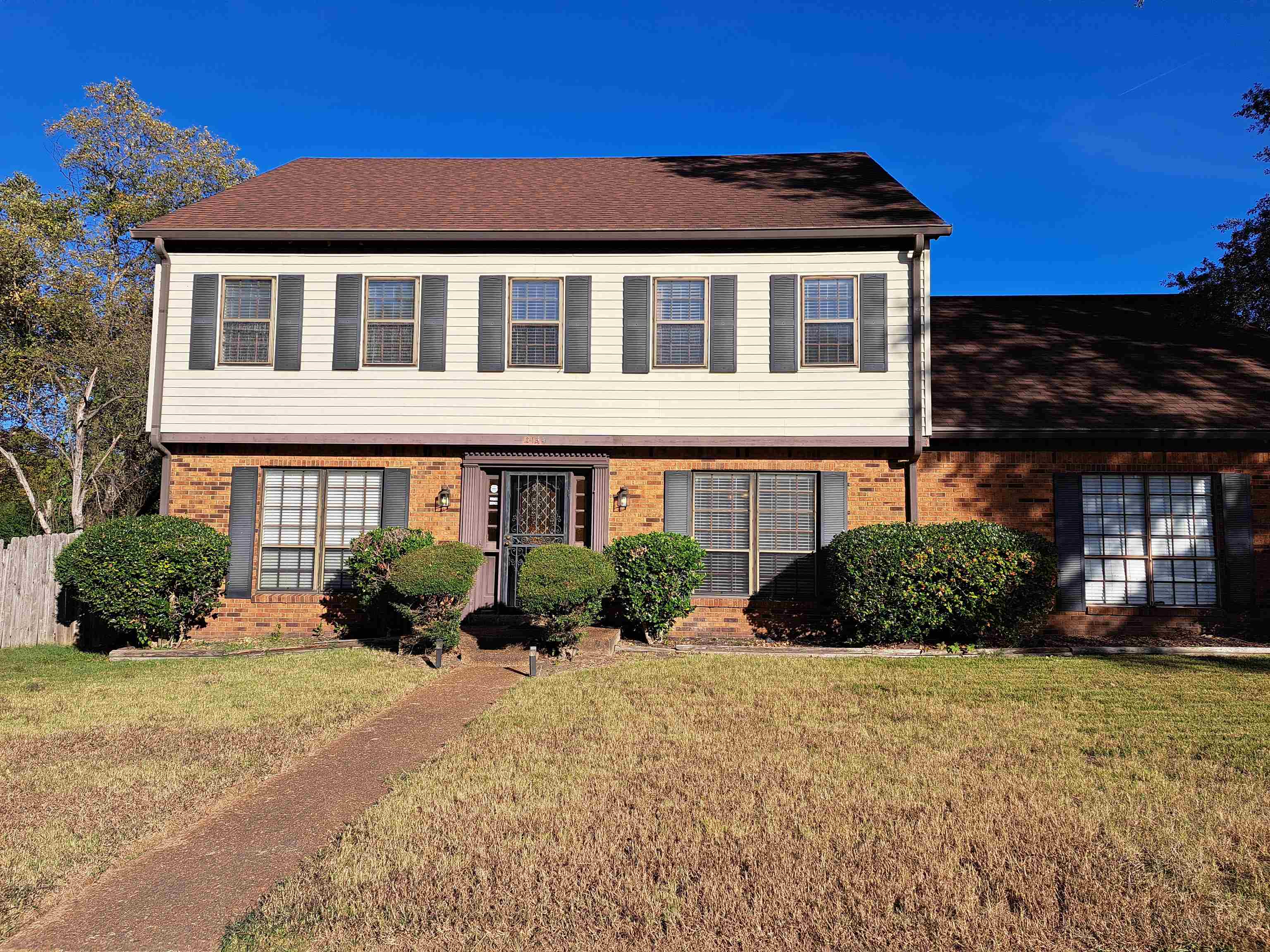 a front view of a house with a yard
