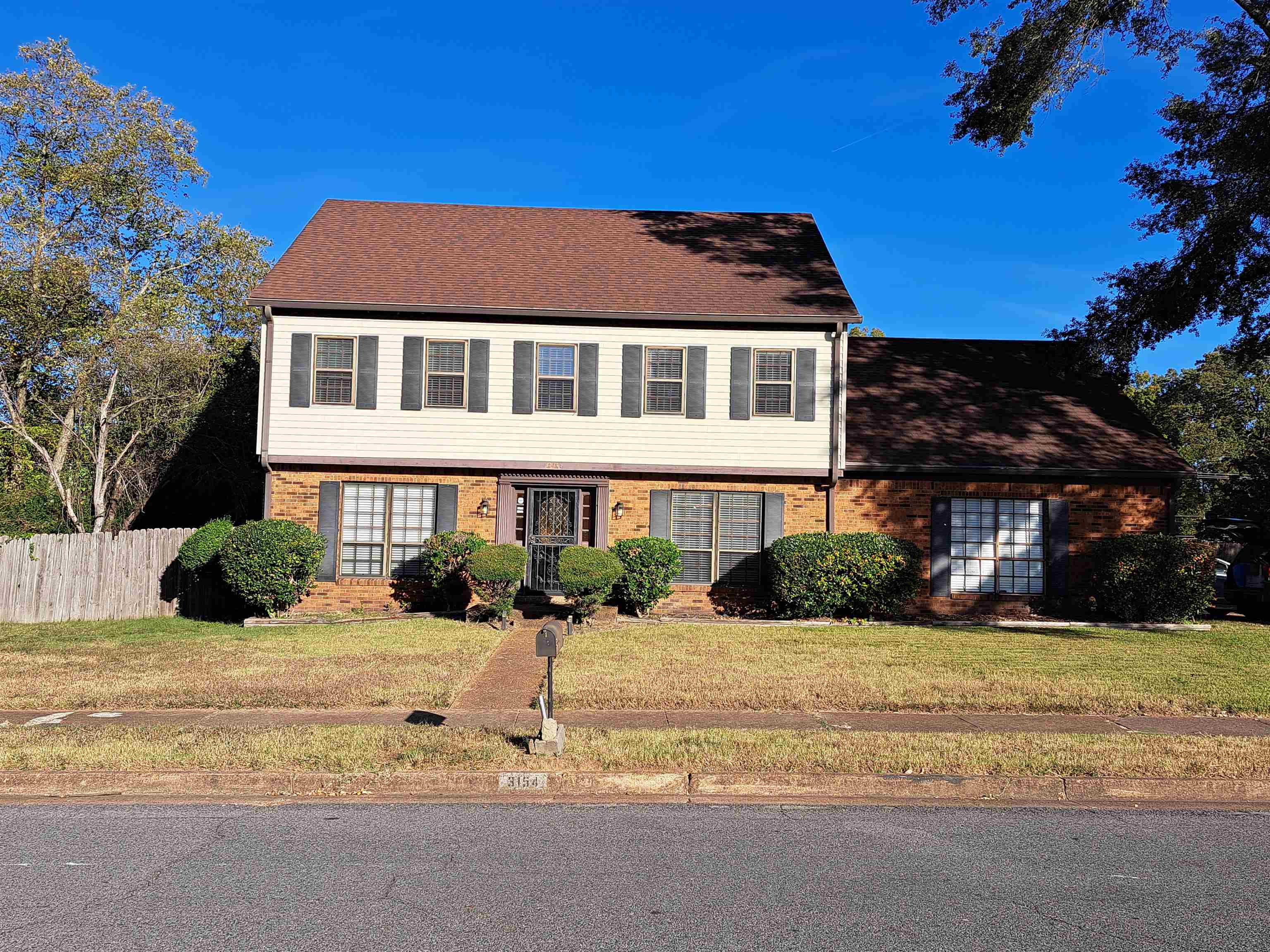 3154 Raleigh Ridge Drive Memphis, TN 38128 - Photo 2 of 18 a front view of a house with a yard