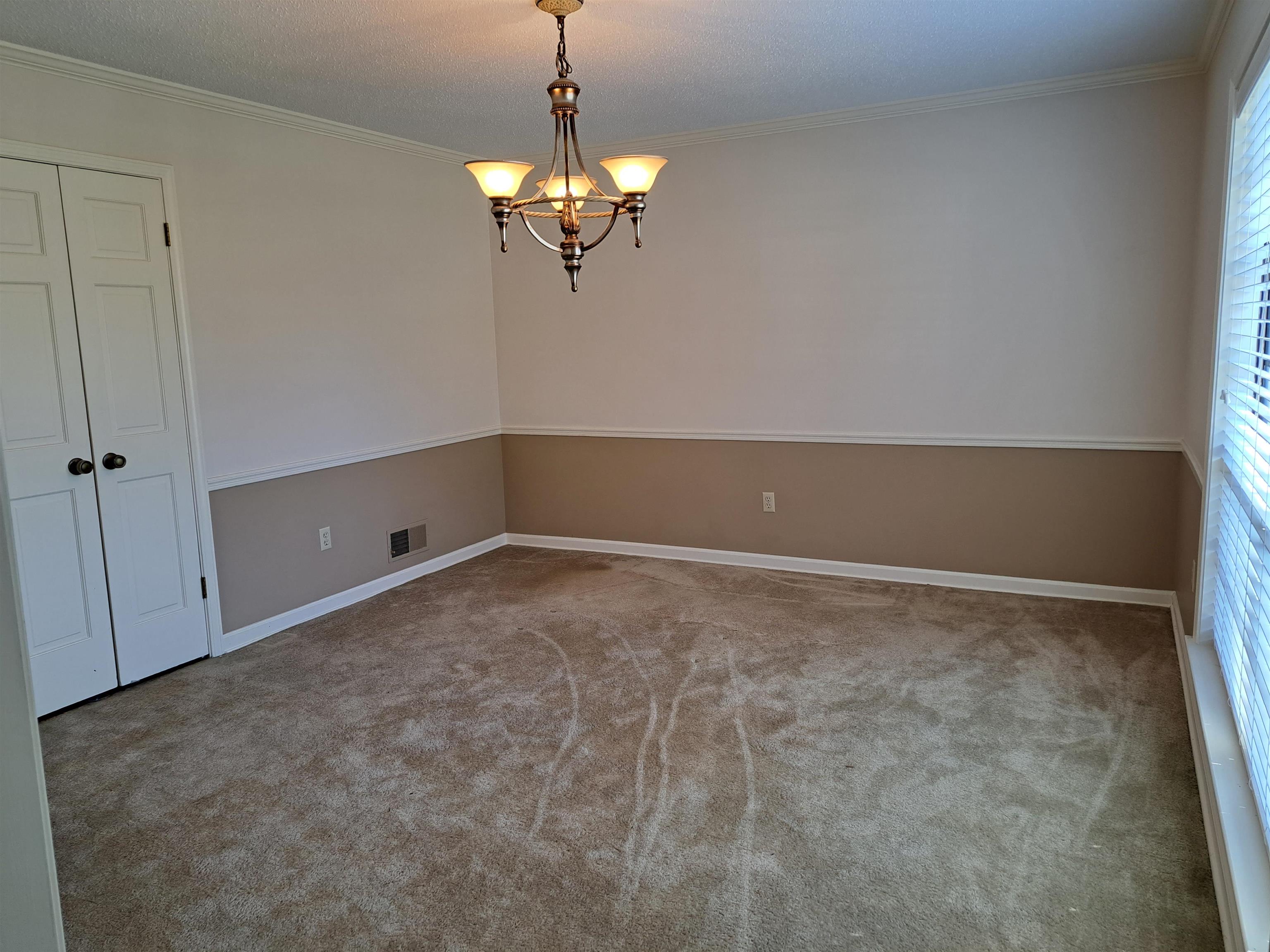 3154 Raleigh Ridge Drive Memphis, TN 38128 - Photo 4 of 18 a view of a chandelier in big room and chandelier