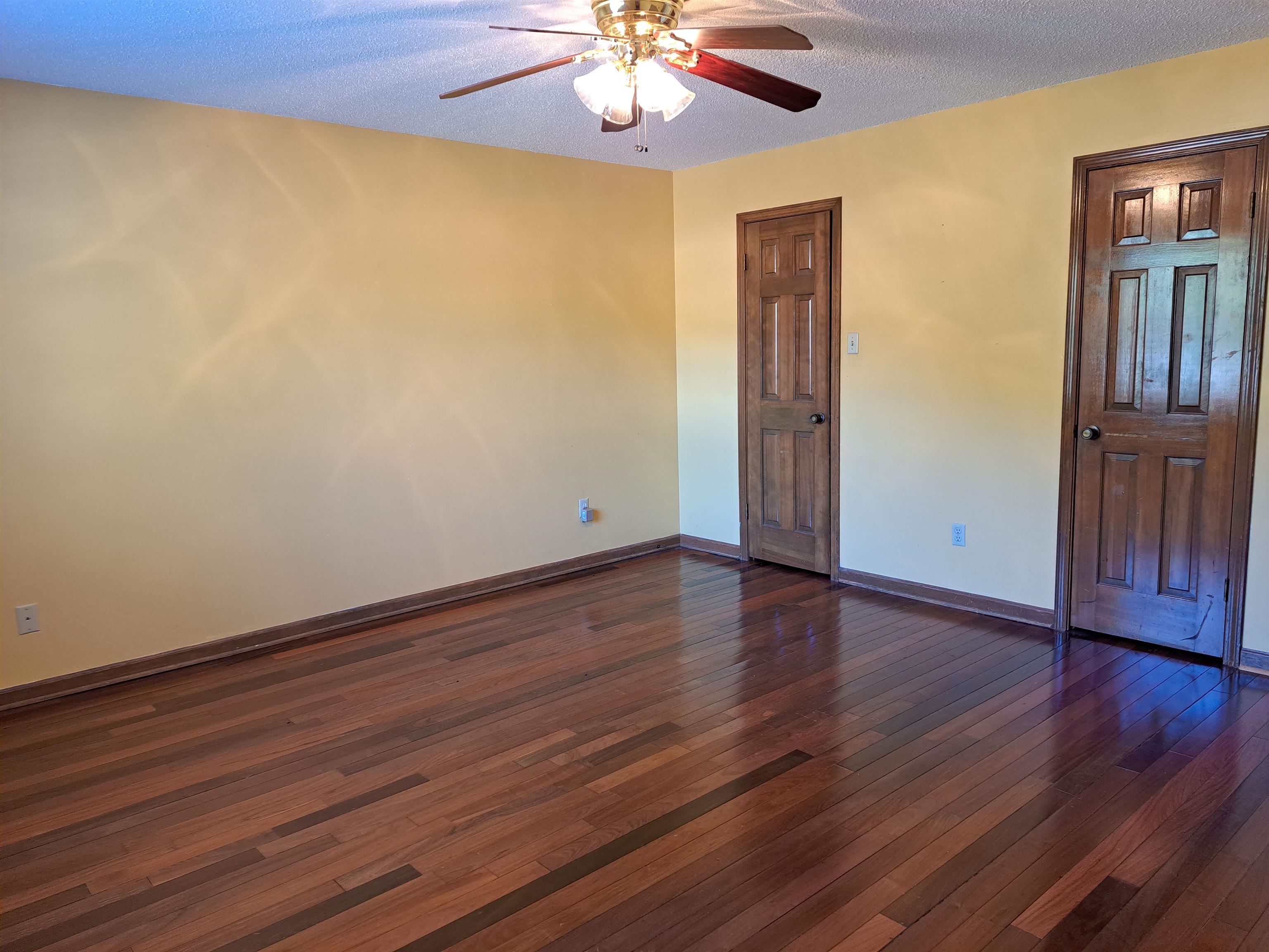 3154 Raleigh Ridge Drive Memphis, TN 38128 - Photo 8 of 18 a view of an empty room with wooden floor