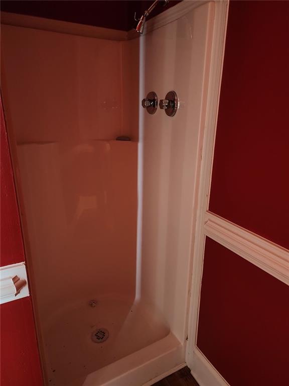 6958 Main Street Lithonia, GA 30058 - Photo 43 of 55 a bathroom with a shower