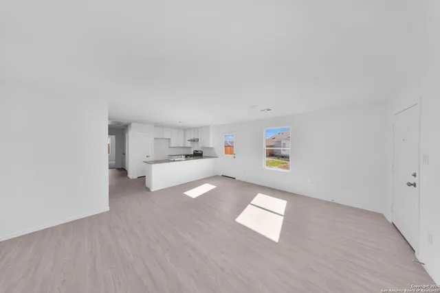 a view of workspace with wooden floor and window