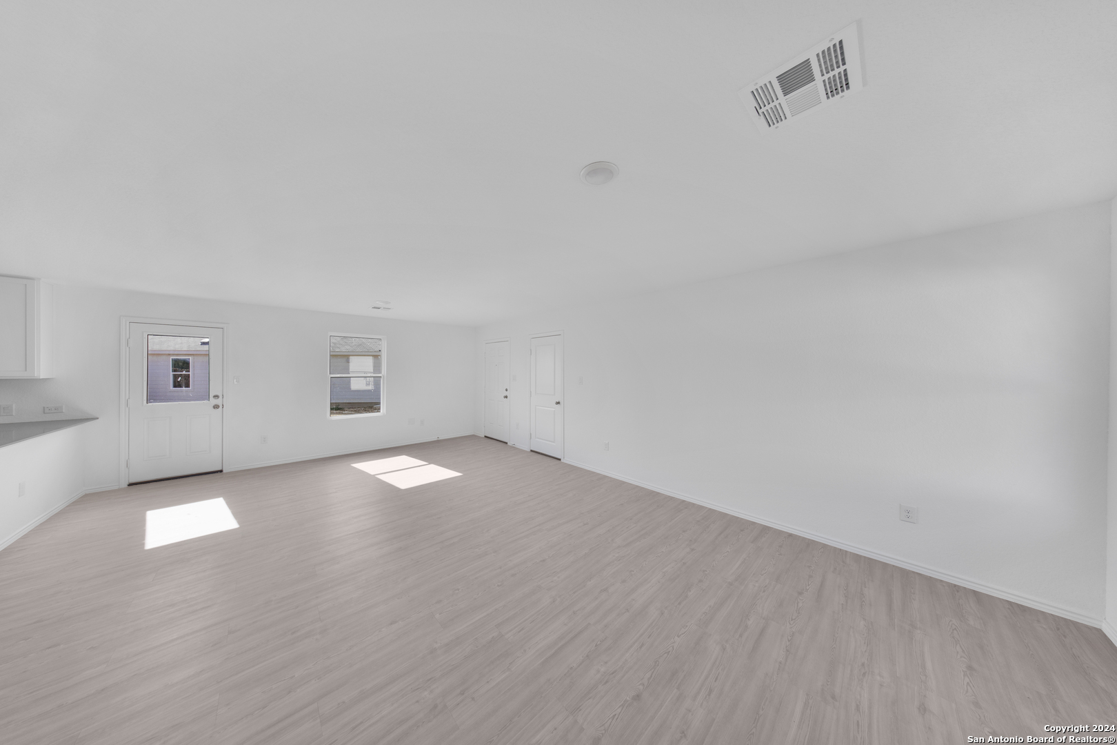 13611 Appleton Way San Antonio, TX 78253 - Photo 4 of 12 a view of empty room with wooden floor