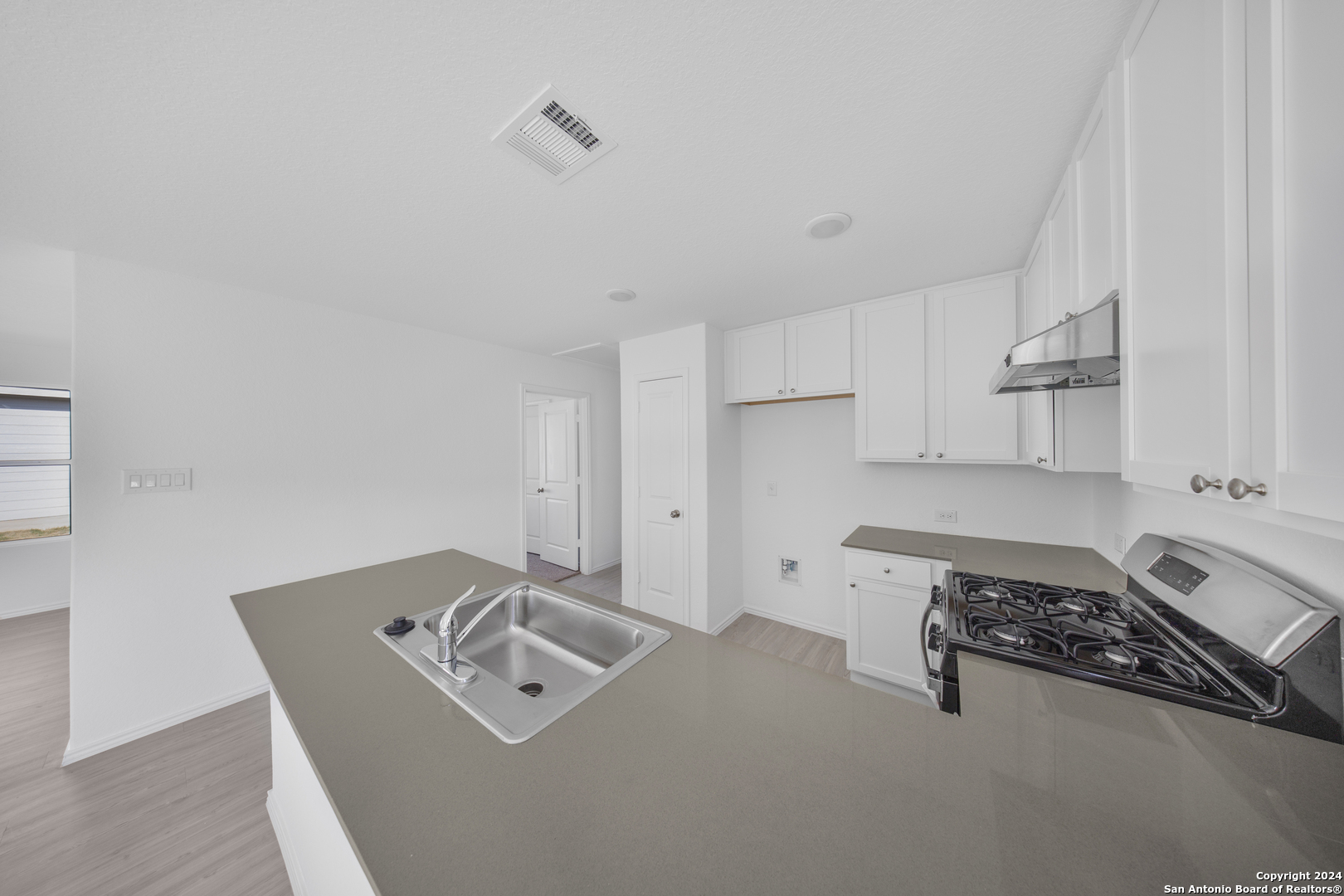 13611 Appleton Way San Antonio, TX 78253 - Photo 6 of 12 a utility room with sink dryer and washer