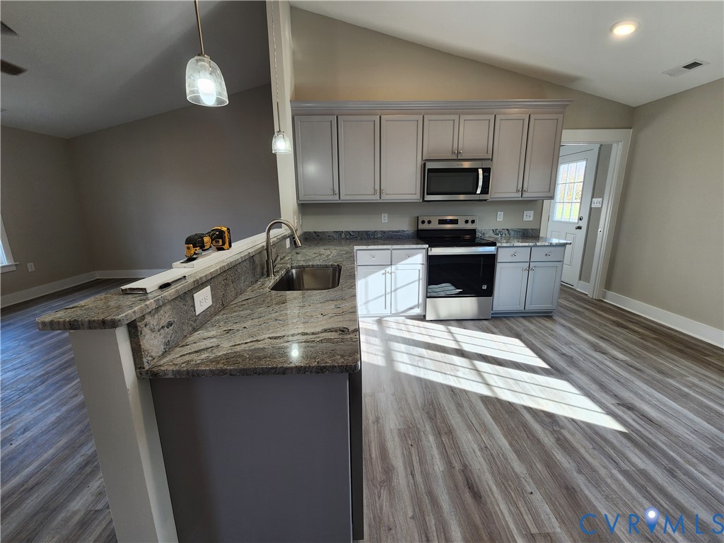 Lot 2 Owens Mill Road St. Stephens Church, VA 23148 - Photo 5 of 20 a kitchen with granite countertop a sink dishwasher a stove and a refrigerator with wooden floor