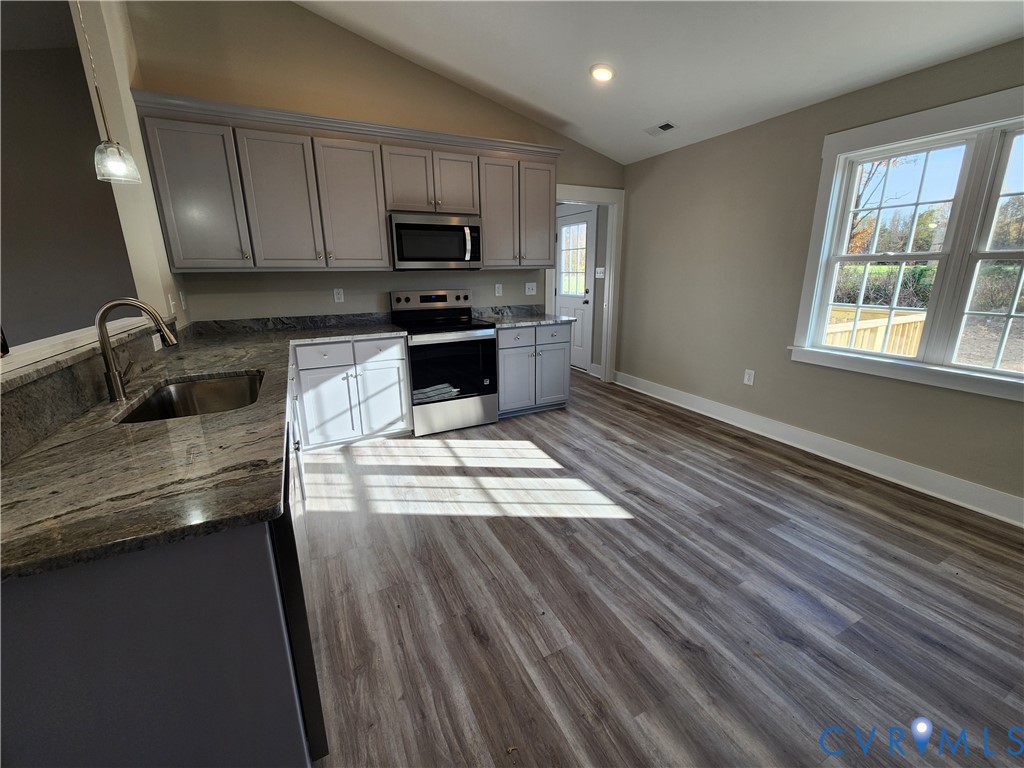 Lot 2 Owens Mill Road St. Stephens Church, VA 23148 - Photo 6 of 20 a kitchen with granite countertop a stove a sink and a microwave