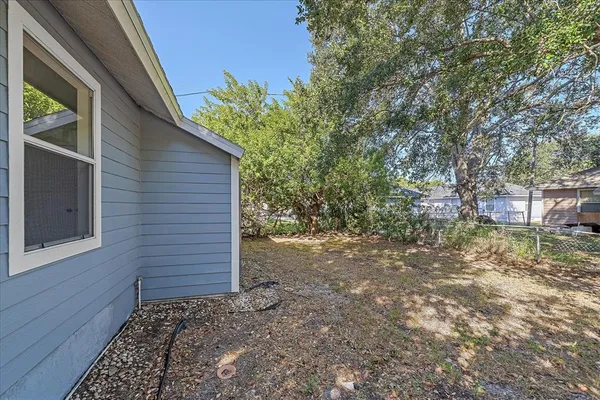a view of a pathway of a house with backyard