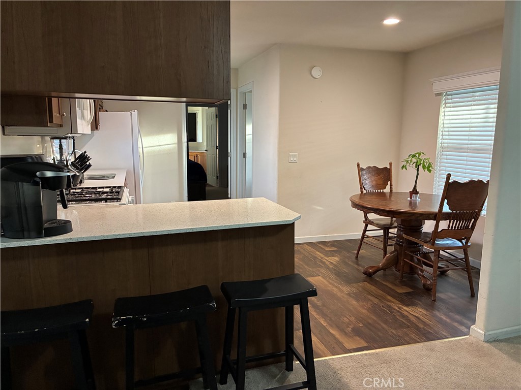 2 Rancho Grande Circle Atwater, CA 95301 - Photo 2 of 14 a kitchen with a table chairs and microwave