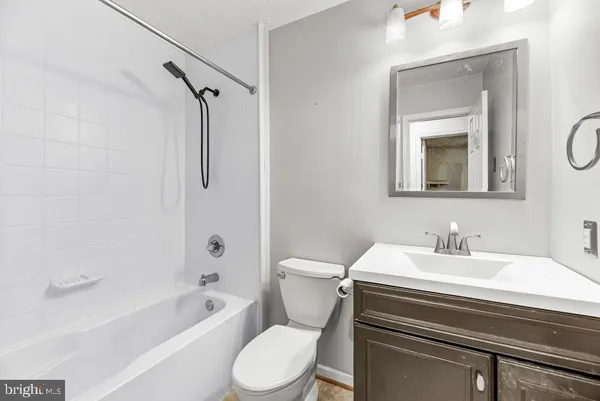 a bathroom with a sink a toilet and a bathtub