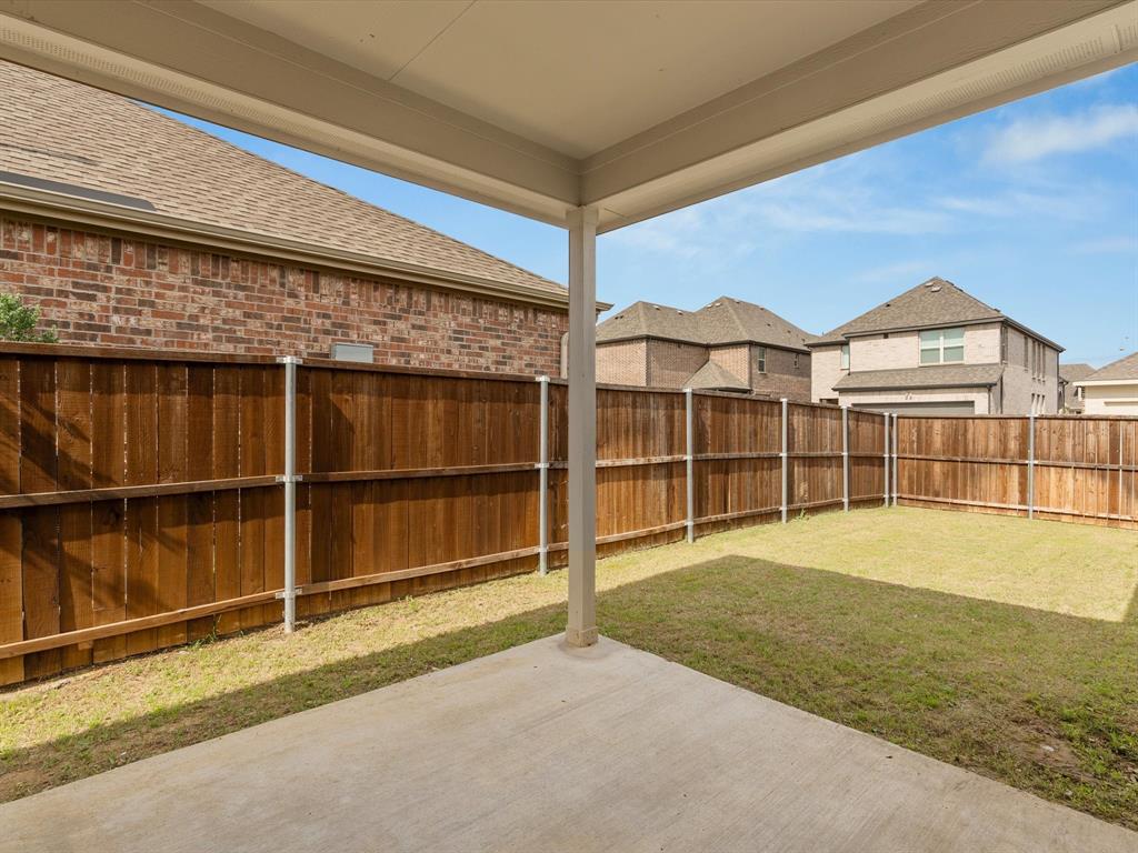 16936 Post Cedar Drive Justin, TX 76247 - Photo 23 of 30 Bedroom featuring crown molding, wood-finish flooring, two large windows, and a ceiling fan with light fixture