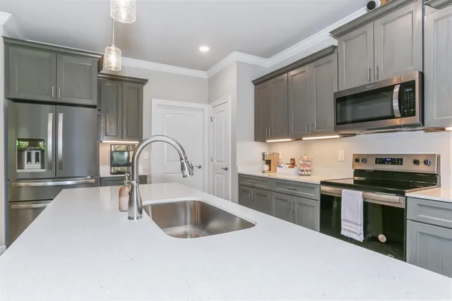 a view of living room with furniture flat screen tv and floor to ceiling window