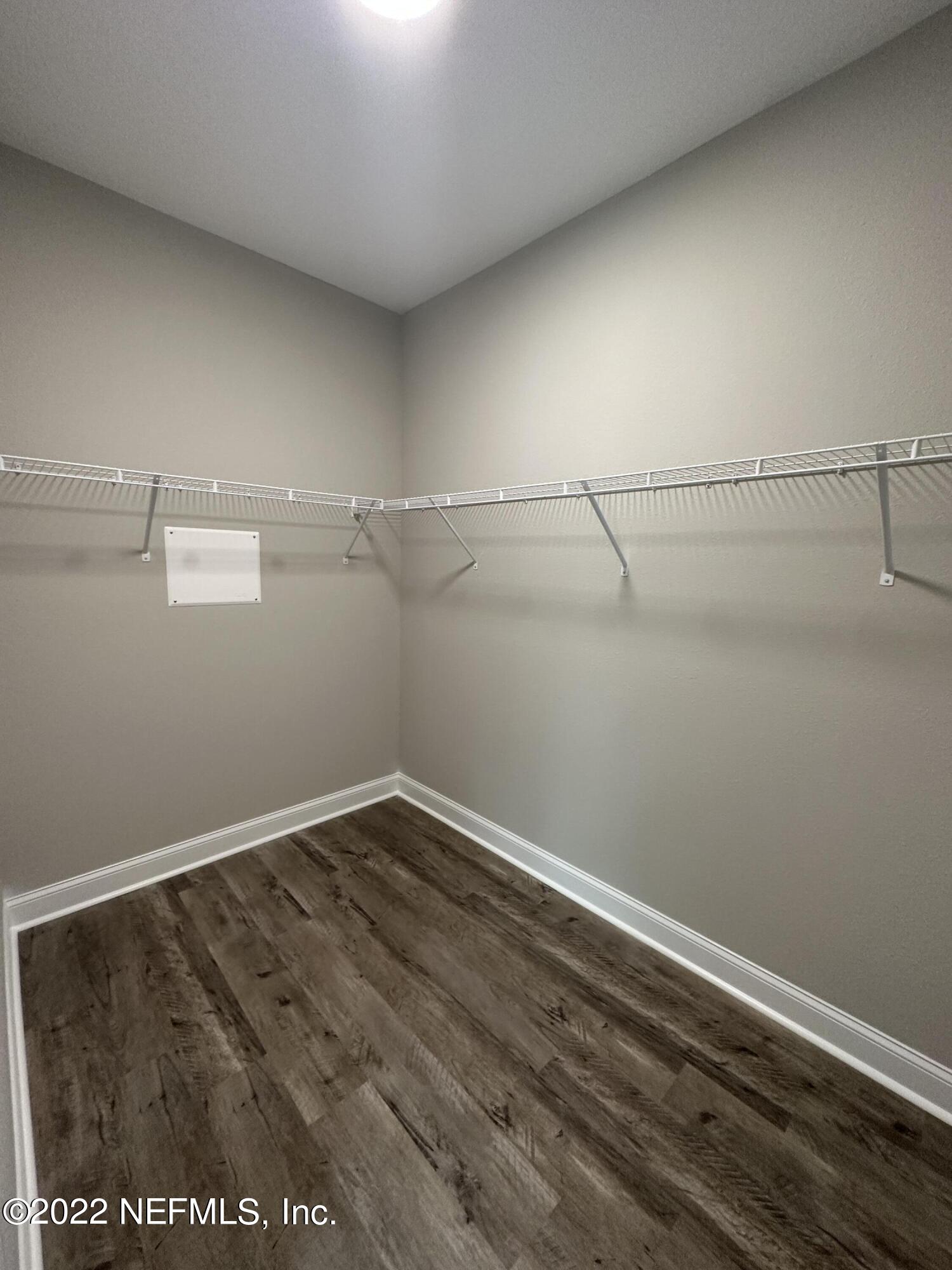 6458 Heidi Road Jacksonville, FL 32277 - Photo 20 of 26 a view of a room with racks on the wall