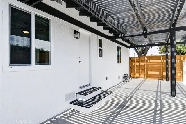 a view of an empty room with glass door
