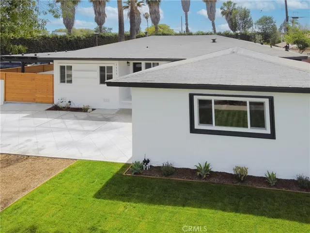view of a house with a yard