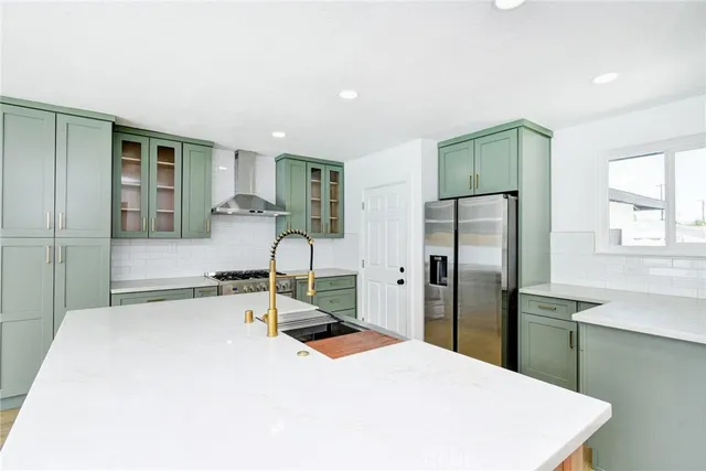 a room with a bed and a refrigerator