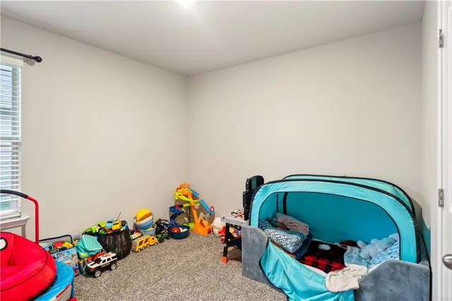 a living room with lots of furniture and a flat screen tv