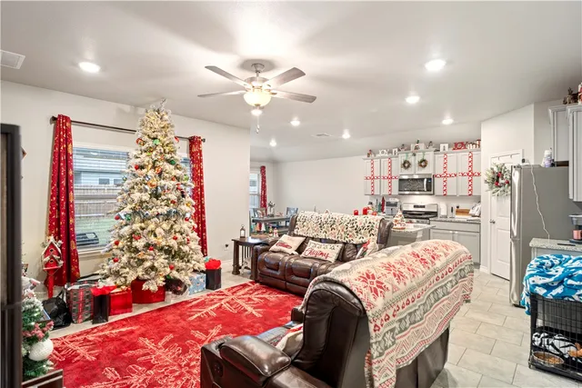 a kitchen with granite countertop a sink stove and refrigerator