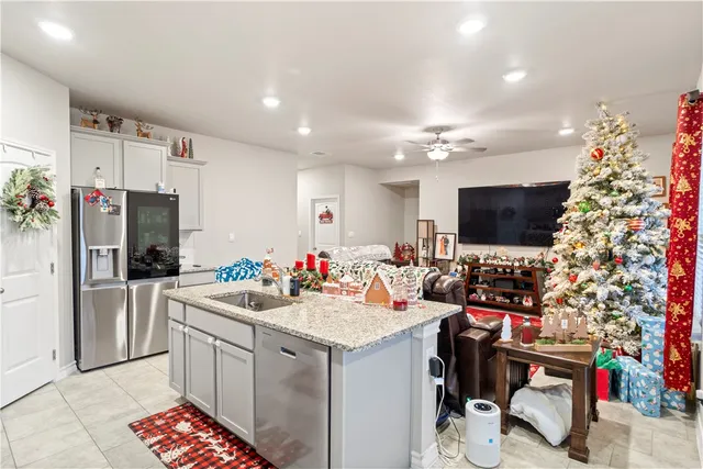 a bathroom with a sink a toilet and shower curtain