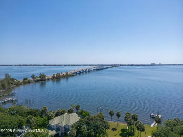 a view of a house with swimming pool and sitting area