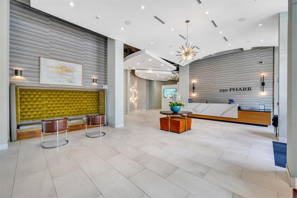 250 Pharr Road Northeast, Unit 310 Atlanta, GA 30305 - Photo 1 of 1 an outdoor space with chairs